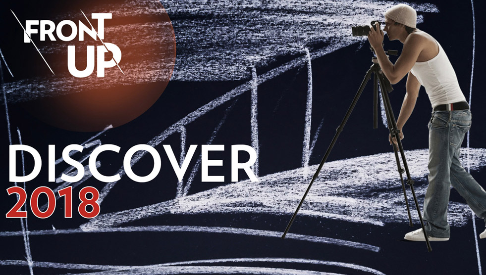 A graphic with a young person looking through a camera on a tripod. The text says Front Up, Discover 2018
