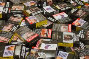 Ugly: a pile of empty cigarette boxes with health warnings